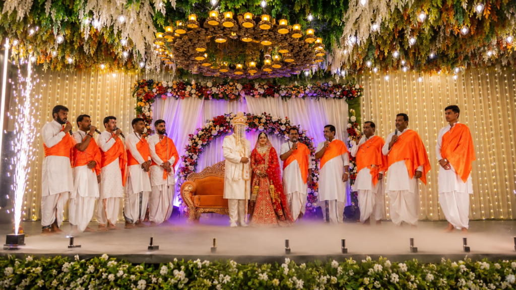 Jaimal with Vedic Mantrochar – bride and groom exchanging flower garlands at a traditional Hindu wedding ceremony